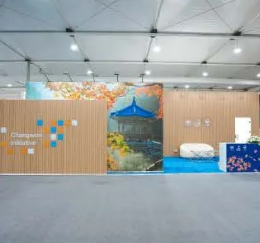 Custom timber-panel exhibition booth designed and built by The Concept WLL